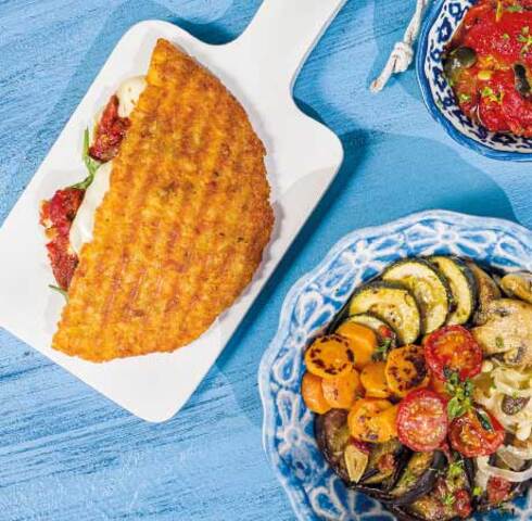 Rösti panini with peperonata, antipasti vegetables, baby spinach and Scamorza Image