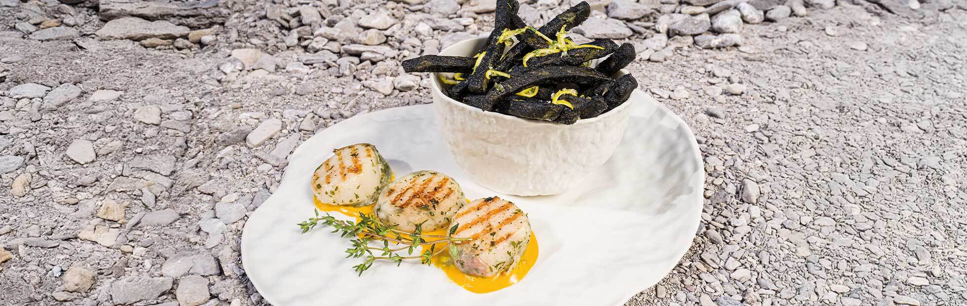 Cuttlefish and lemon fries with scallops in a lardo-bacon and herb coating and saffron sauce