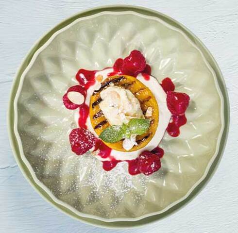 Potato and almond ice cream with grilled peach melba and crème fraîche Image