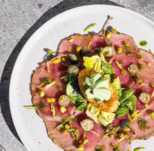 Tuna carpaccio with Mini Rösti Boats, basil espuma and pistachios Image