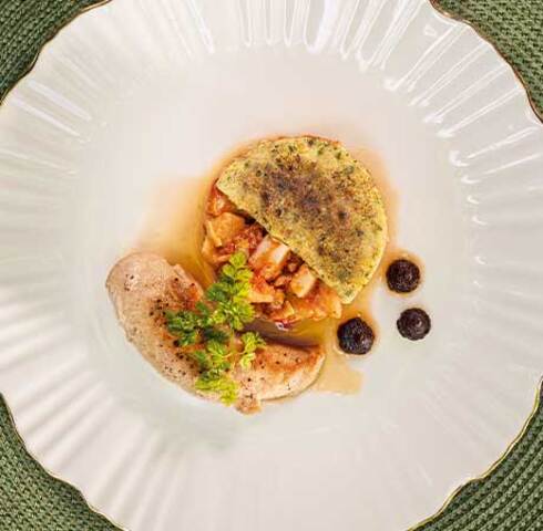 Potato and artichoke ragout with herb crust, rabbit fillet and purple carrot purée Image