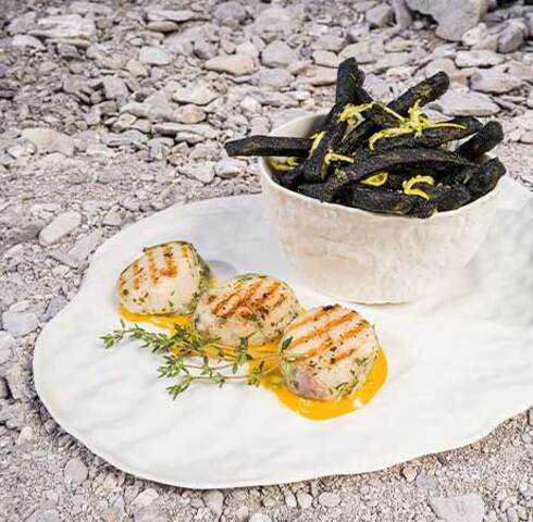 Cuttlefish and lemon fries with scallops in a lardo-bacon and herb coating and saffron sauce Image